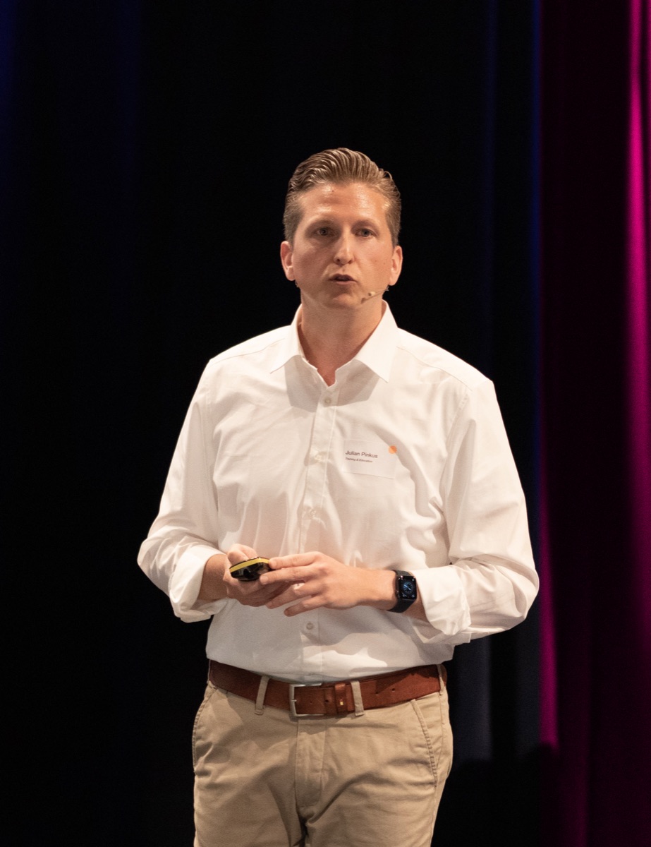 Julian Pinkus, founder of Pink Matter, on stage.